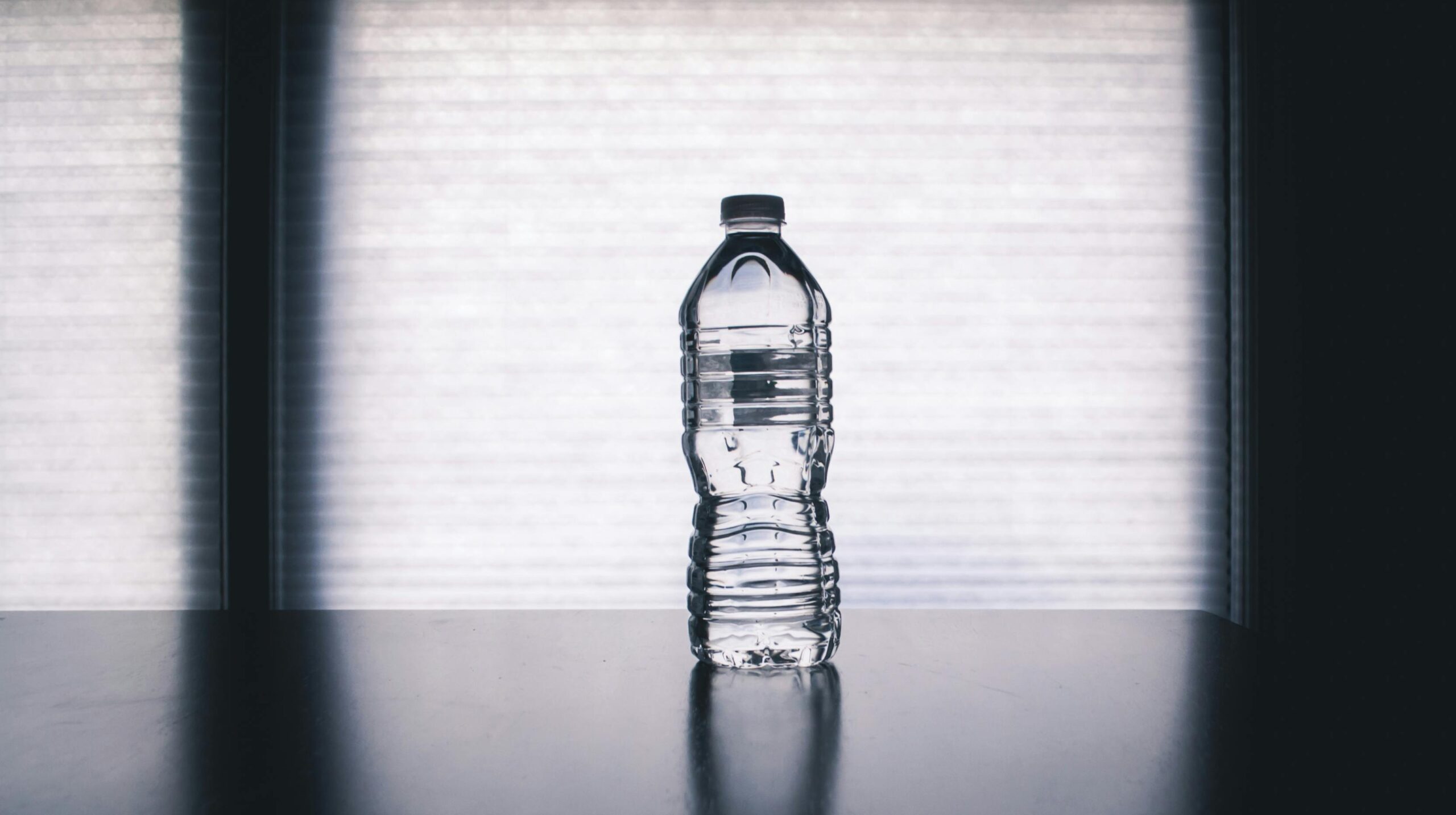 Start your morning with a full glass of water before anything else — your body wakes up dehydrated after several hours without fluids. Drink a glass before each meal, which also supports digestion and helps you feel fuller. Carry a reusable water bottle and refill it consistently throughout the day. If you exercise, begin drinking before you feel thirsty and continue after your session, since exercise-induced fluid losses continue even after you stop sweating. In hot weather, increase your intake proactively rather than waiting for thirst to guide you. And remember that food contributes roughly 20 percent of your daily water intake — fruits, vegetables, soups, and other water-rich foods all count.